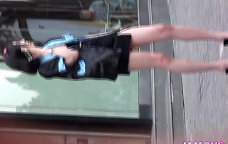 Chinese bombshell gets caught flashing her little tits on the street.